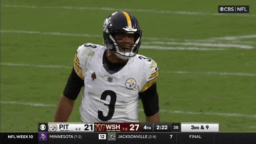 a football player wearing a number 3 jersey stands on the field
