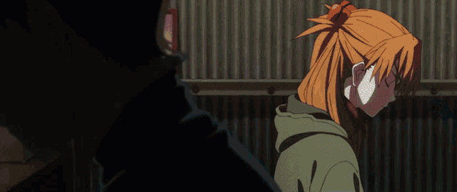 a man and a woman are standing next to each other in a dark room