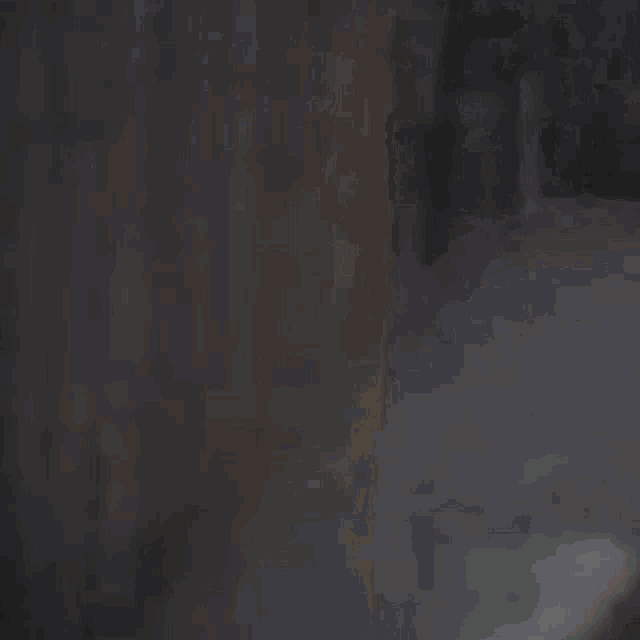a blurry picture of a person 's face with a white shirt on