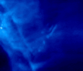 a dark blue background with a lot of smoke coming out of it .