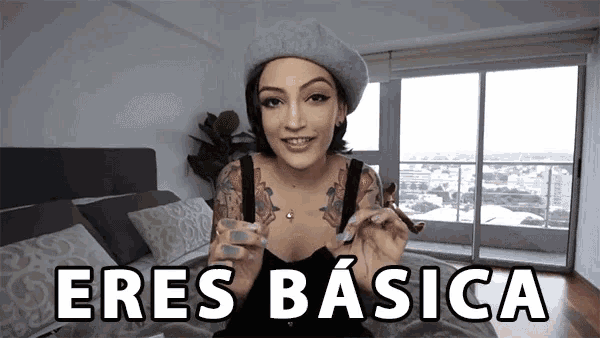 a woman wearing a beret and holding a cigar says eres basica in white letters
