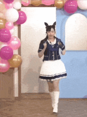 a girl in a white skirt and white boots is running in a room with balloons .