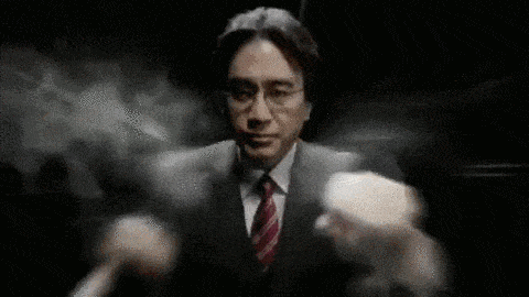 a man in a suit and tie is standing in the dark with his arms outstretched .