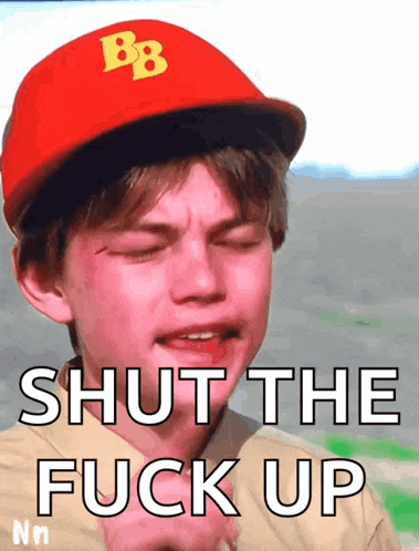 a boy wearing a red hat with the letter bb on it says shut the fuck up