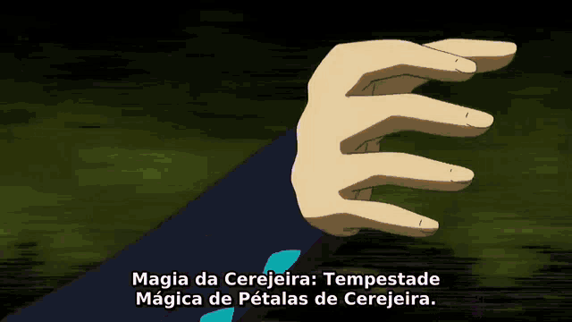 a close up of a person 's hand with magia da cerejeira tempestade magica de petalas de cerejeira