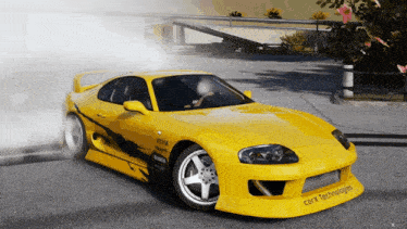 a yellow car that says carx technologies on the front of it