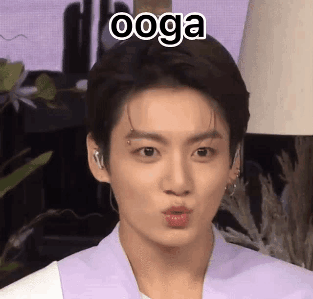 a close up of a person 's face with the word ' ooga ' on it .