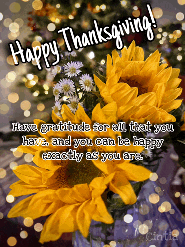 a happy thanksgiving message with sunflowers in the background