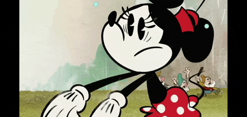 a cartoon of minnie mouse standing in front of a group of dwarves