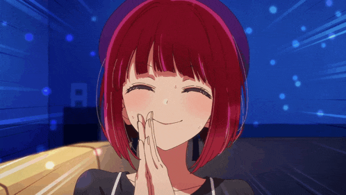 a girl with red hair is smiling with the letter r behind her