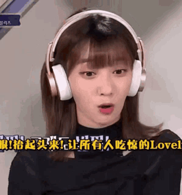 a woman wearing headphones with chinese writing on the bottom