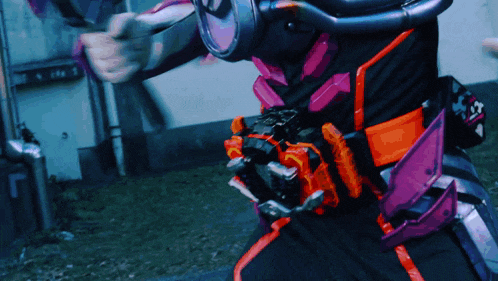 a person wearing a purple and orange costume with a belt that says ' samurai ' on it