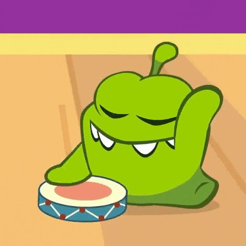 a green cartoon character is eating something from a blue bowl