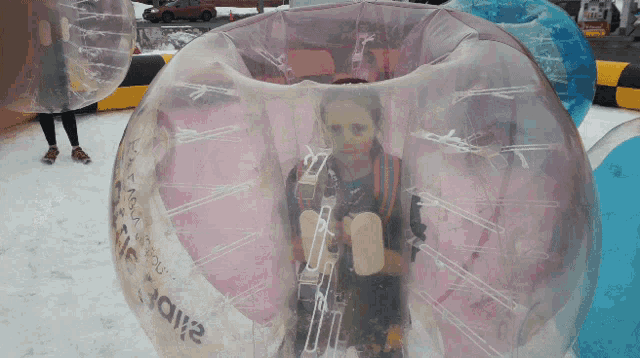 a girl is inside a bubble that says ' bubble ' on it