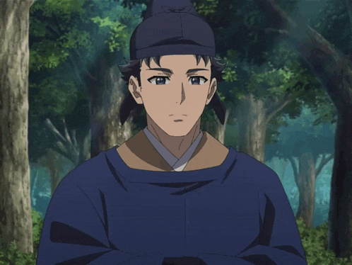 a man wearing a blue cape and a black hat is standing in a forest