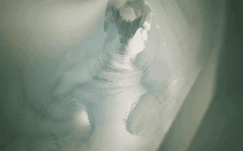 a computer generated image of a tunnel with a statue of a person in the middle .