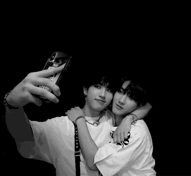 a person taking a selfie with a phone that says stay
