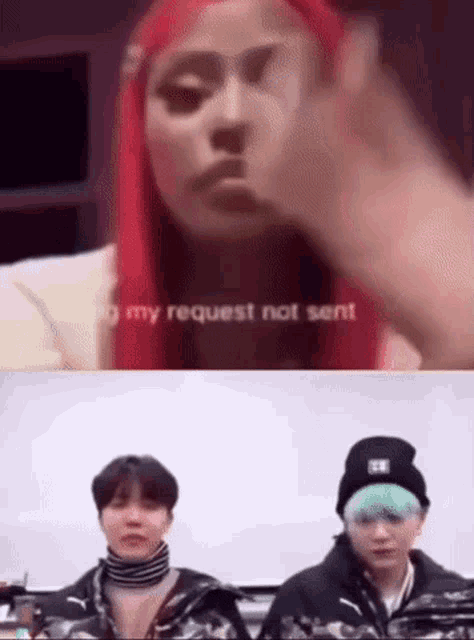 a woman with red hair is giving a middle finger while a man and a girl are sitting next to each other .