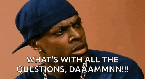 a man wearing a hat and chains is asking what 's with all the questions , daaammn !!