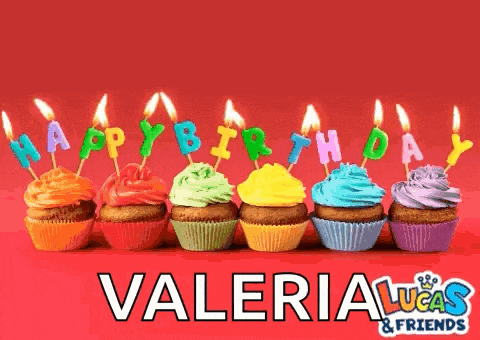 a row of colorful cupcakes with candles that spell out happy birthday