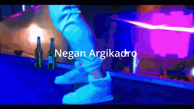 a person 's feet are shown with the name negan argikadro written on the bottom