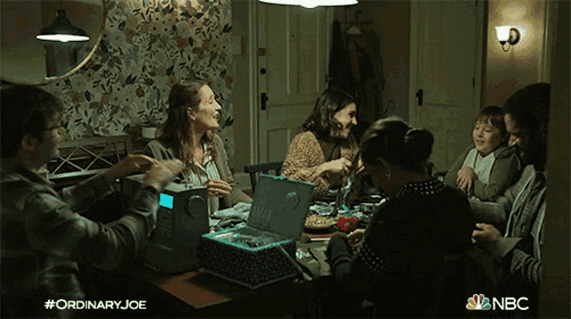 a group of people sitting around a table with the hashtag #ordinaryjoe