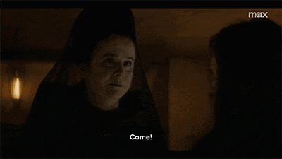 a woman in a veil is talking to another woman and the words come are on the screen