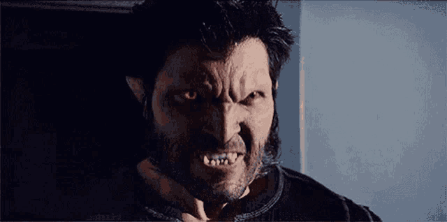 a close up of a man with a wolf 's face