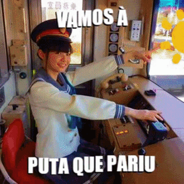a woman in a sailor outfit is sitting at a desk with the words vamos a puta que pariu