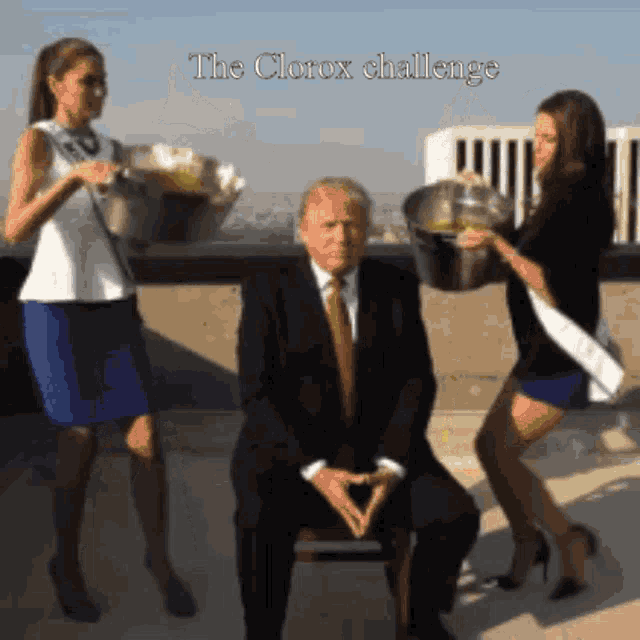 a man in a suit and tie is surrounded by two women holding buckets with the words " the clorox challenge " above him