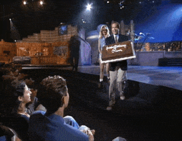 a man holding a cake that says happy birthday steve on it