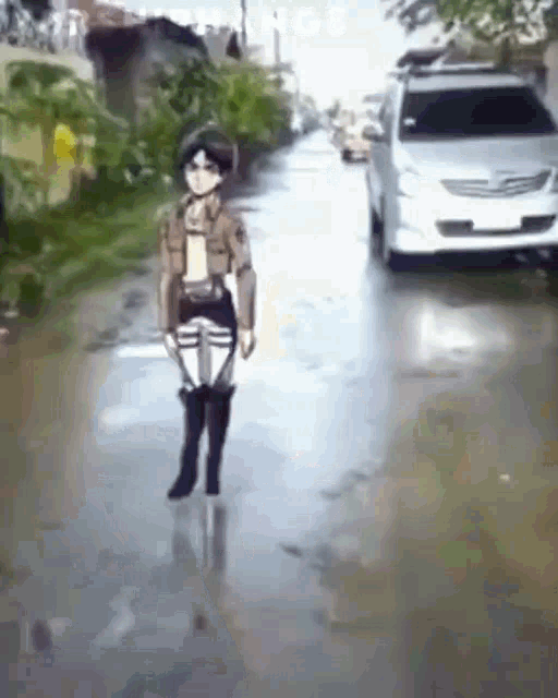 a person is walking down a flooded street next to a white car .