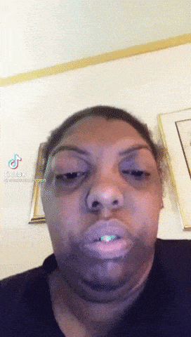 a close up of a woman 's face with a tiktok watermark