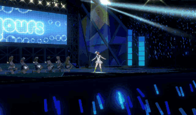 a girl is standing on a stage in front of a large screen that says yours