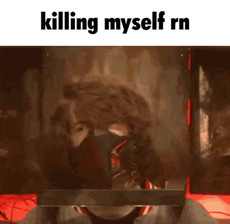 a man wearing a mask is behind a glass with the words killing myself rn written above him