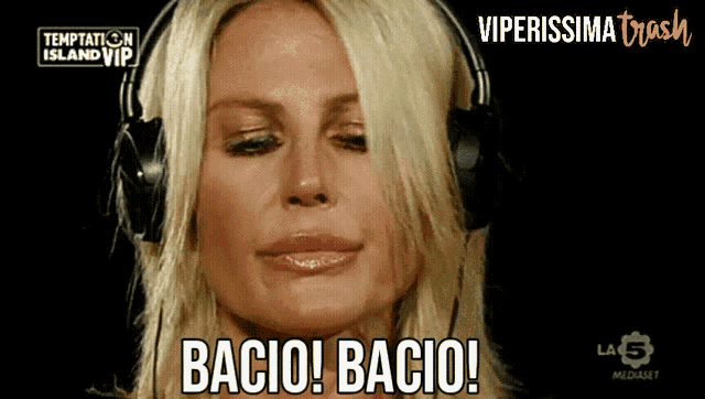 a woman wearing headphones says bacio bacio on the screen