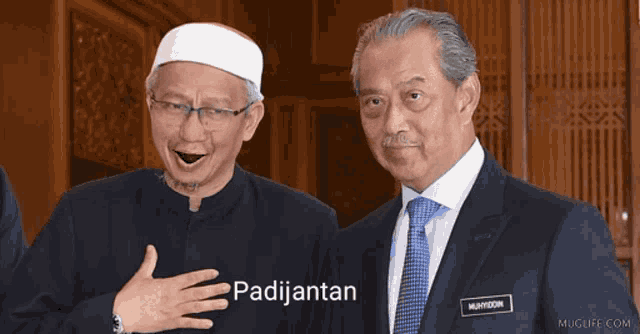 two men are standing next to each other with the word padijantan on the bottom