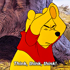 a cartoon of winnie the pooh covering his face with his hands and saying think think think
