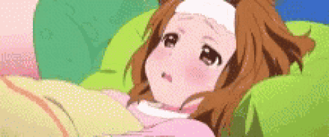 a girl is laying in bed with a bandage on her head .