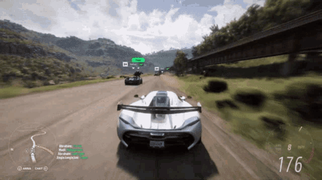 a car is driving down a road with the number 176 on the bottom right