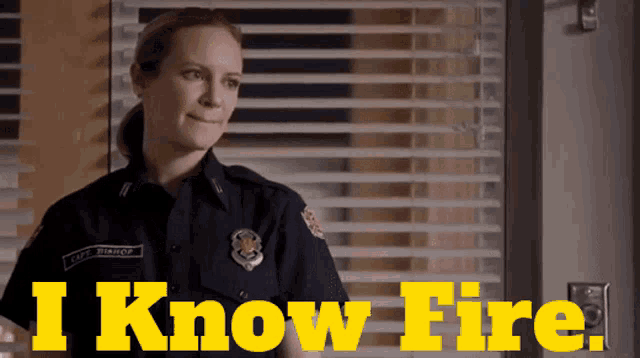 a woman in a police uniform says i know fire