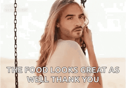 a man with long hair and a beard is sitting on a swing with the words " the food looks great as well thank you "