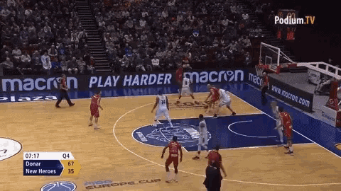 a basketball game is being played in front of a podium tv ad