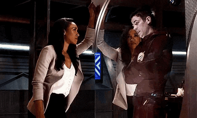 a man and a woman are standing next to each other .