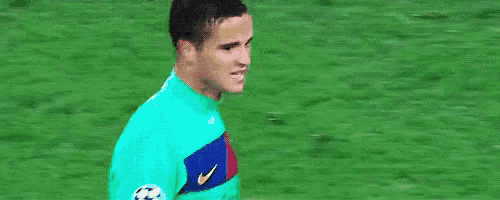 a soccer player is wearing a green nike jersey