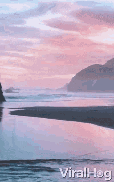 a picture of a beach with the word viralhog on the bottom