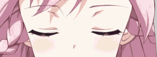 a close up of a girl 's face with her eyes closed and pink hair