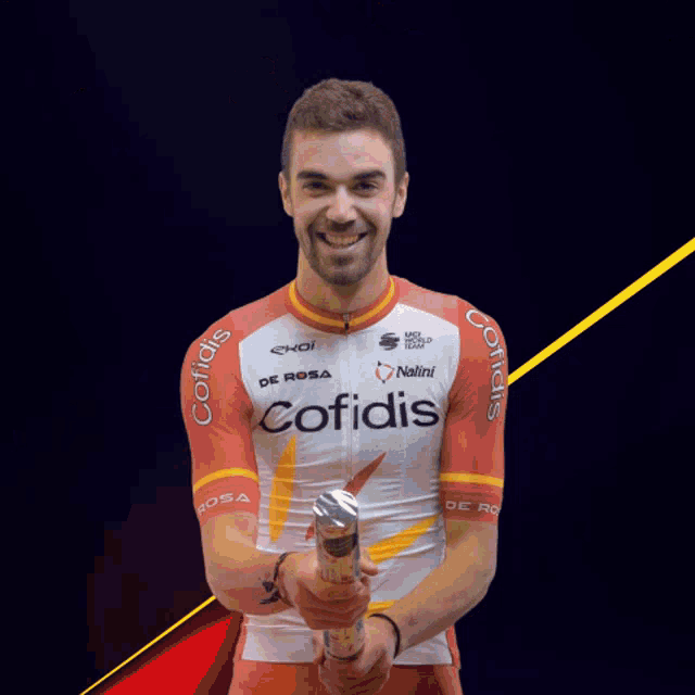 a man wearing a red and white shirt with the word cofidis on it