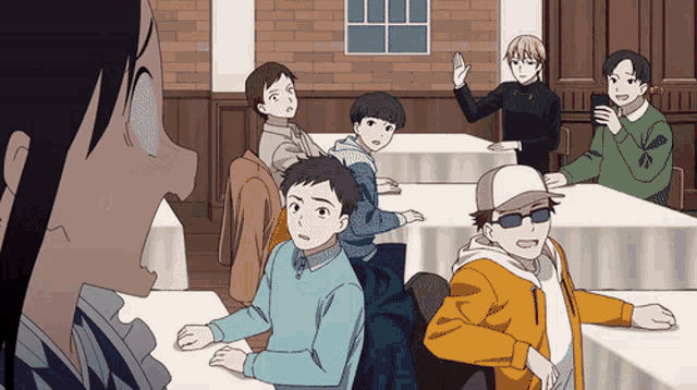 a group of people sitting at tables with one wearing sunglasses and a hat
