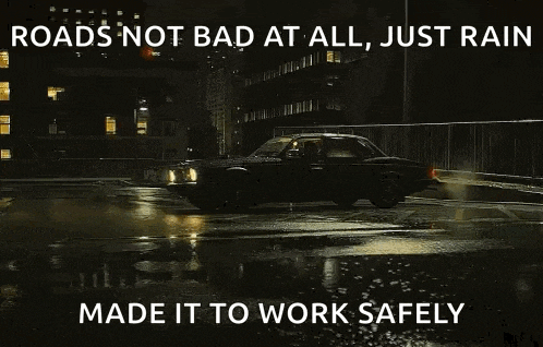a car is driving down a wet road at night with a caption that says roads not bad at all just rain made it to work safely